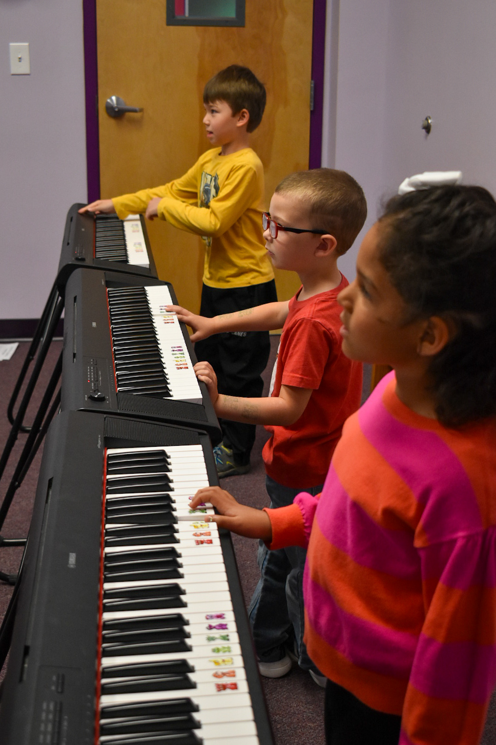 Kids in a Group Piano class